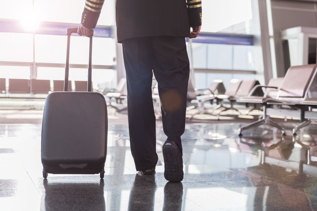 Pilot pulling cabin bag