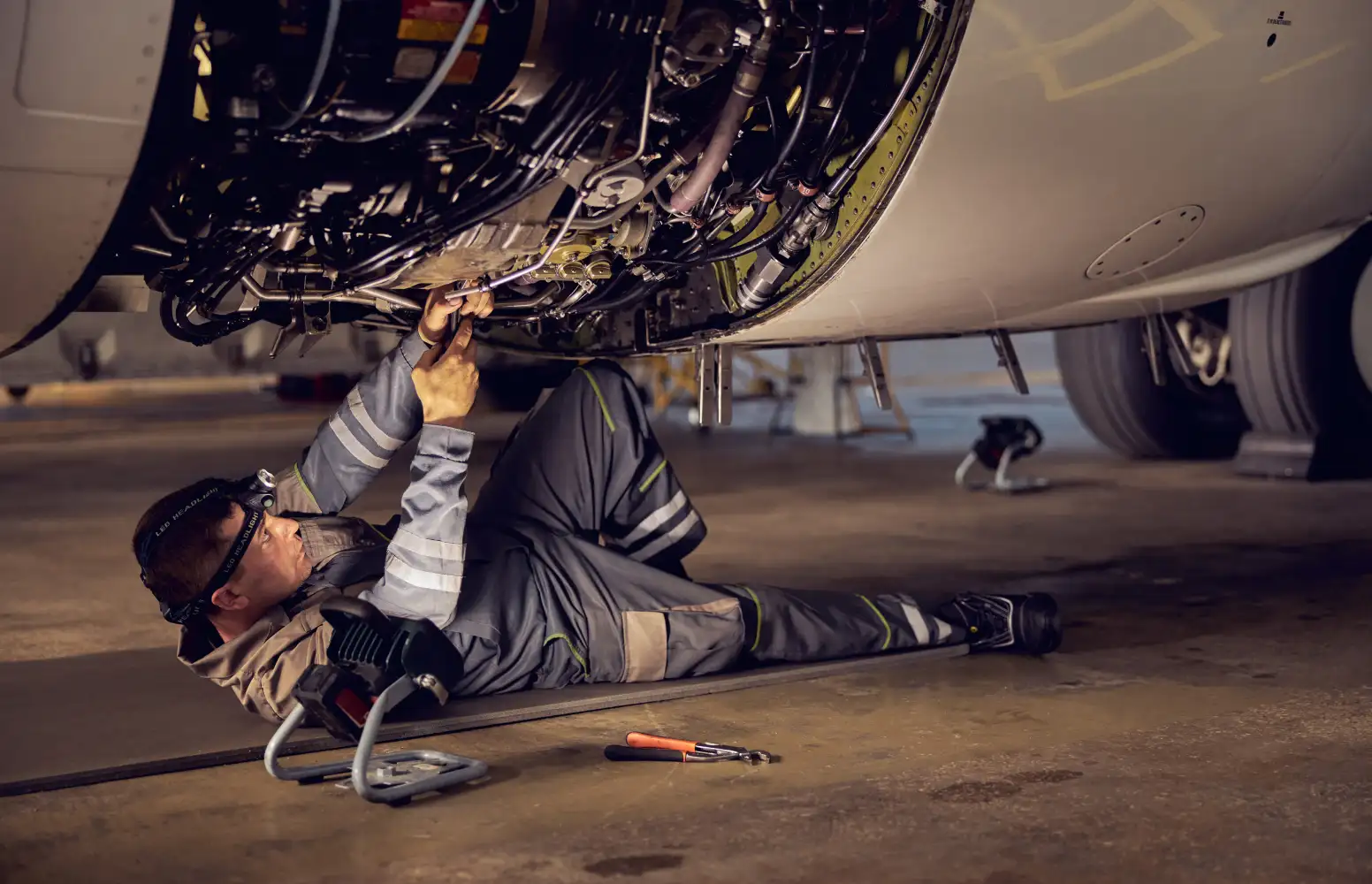 Engineer carrying out aircraft maintenance