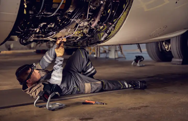 Engineer carrying out aircraft maintenance
