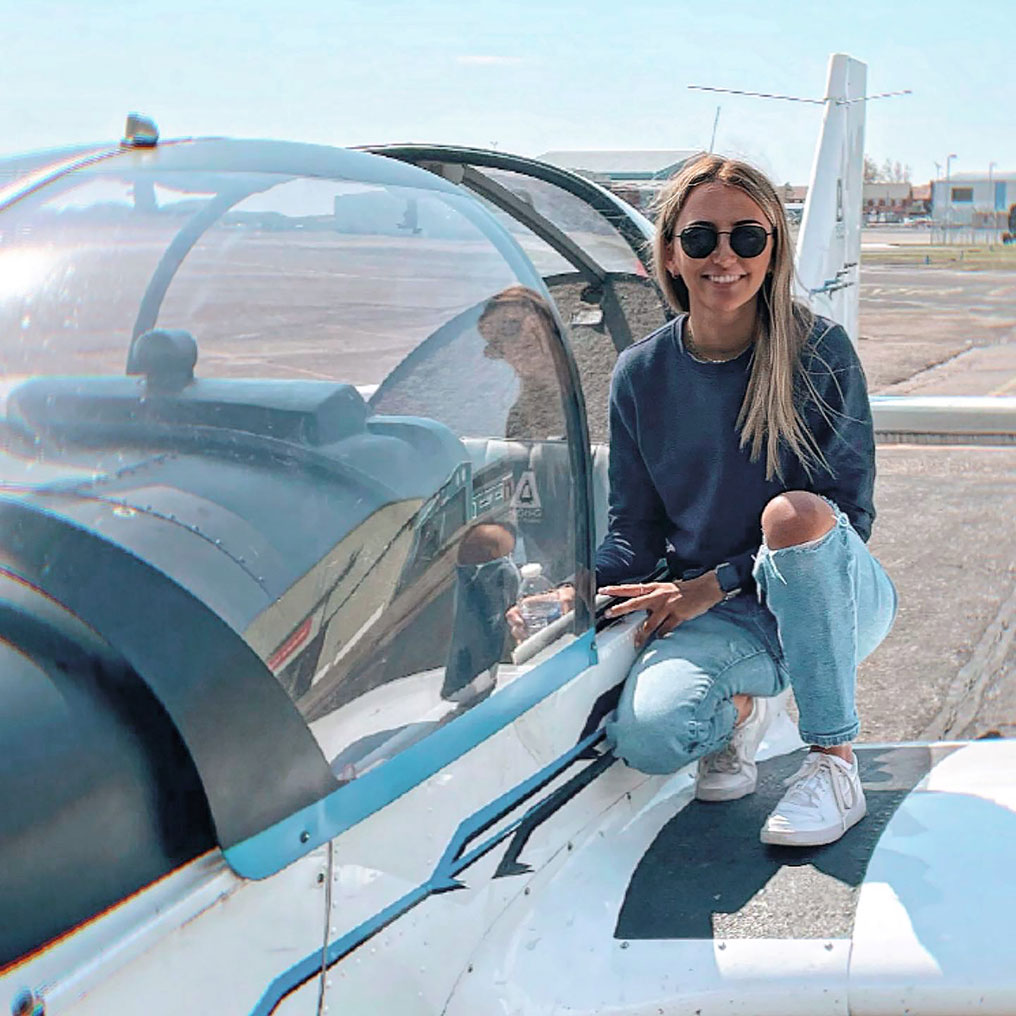 Private pilot next to aircraft