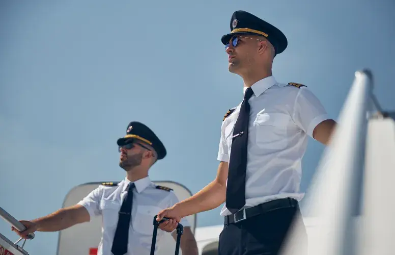 Pilots near an aircraft